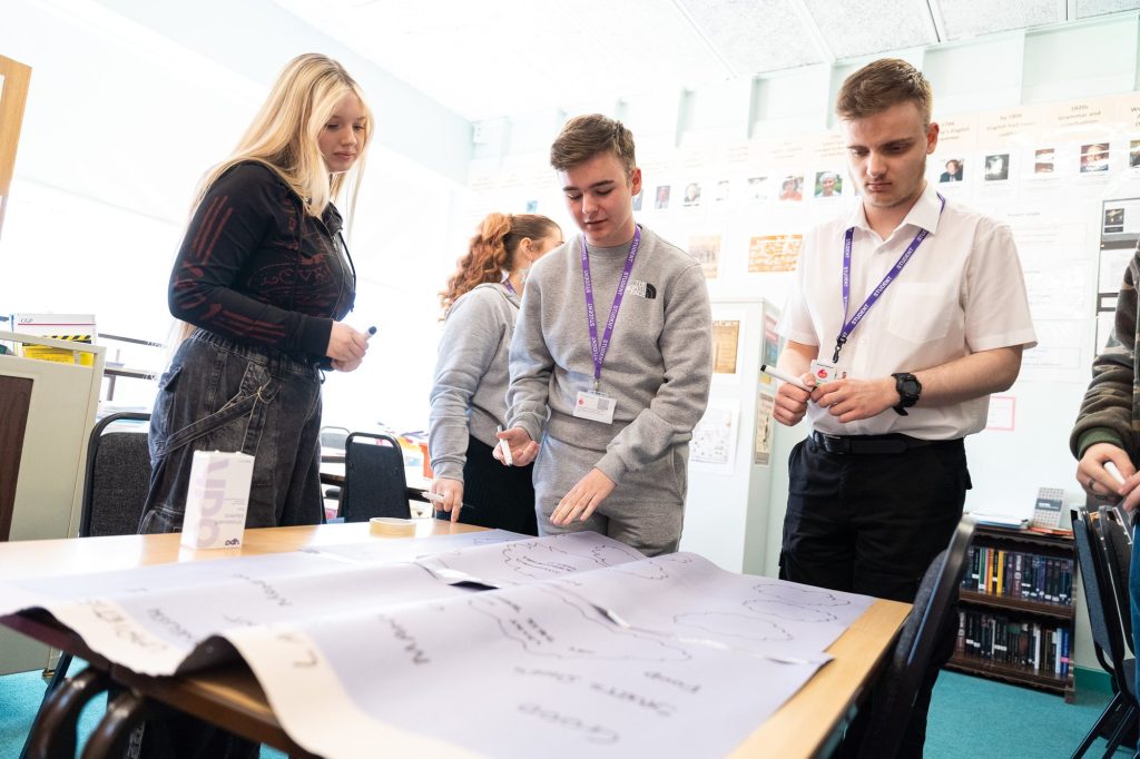 A group planning a project around a table
